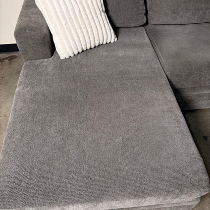 Living Spaces Gray Sectional with Pullout Bed