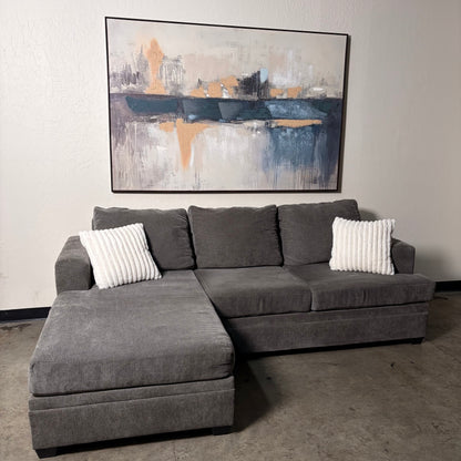 Living Spaces Gray Sectional with Pullout Bed